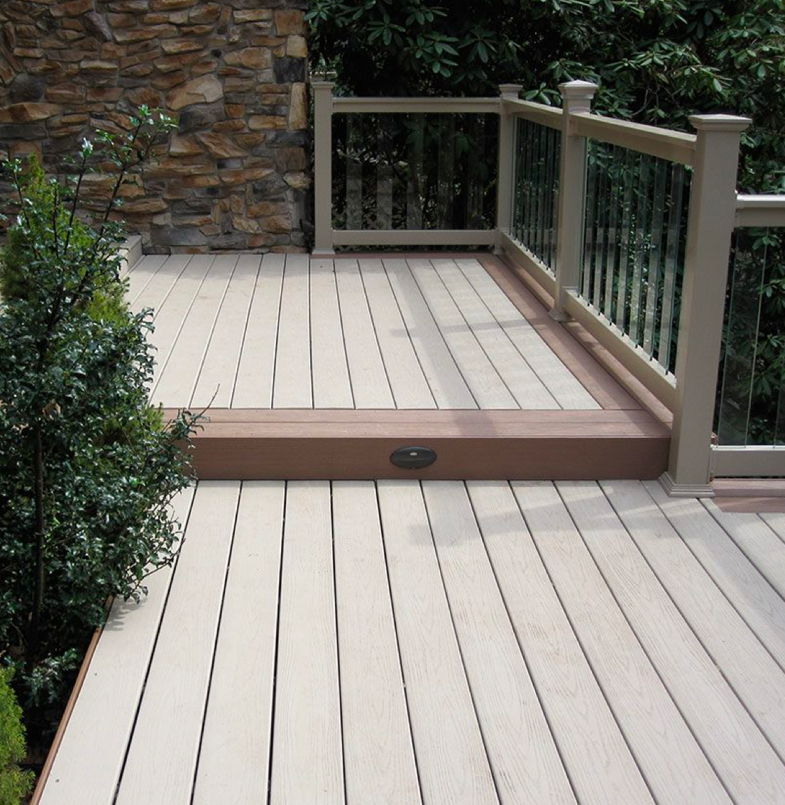 A home balcony with vinyl decking installed by a vinyl supplier.